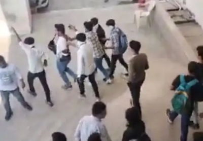 Right wing activists assault youths in university campus in Surat Right wing activists assault youths in university campus in Surat