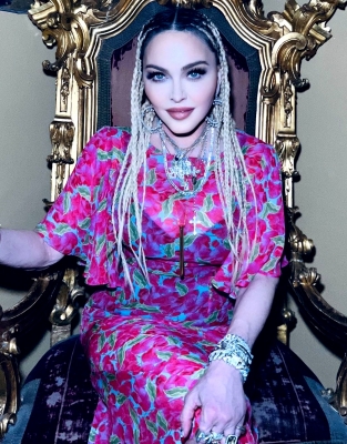 Madonna goes topless again after warning trolls to 'stop bullying' her amid 50 Cent's dig