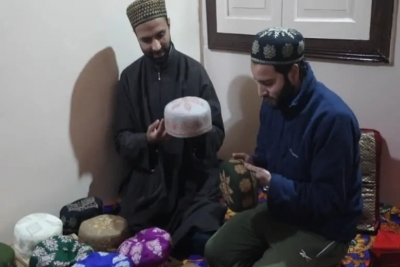 Two Kashmiri friends making a profit by selling traditional Suzni hats online