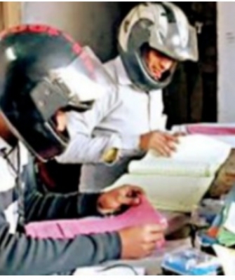 Employees wear helmet while working in UP power department office Employees wear helmet while working in UP power department office