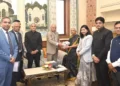 Justice Sanjay Mishra Presents 2024 Annual Report to Governor